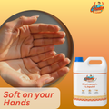 Close-up of soft hands with GleamSure Dishwash Liquid bottle and 'Soft on your Hands' text.
