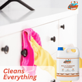 GleamSure cleaner near a cabinet being wiped with a cloth, featuring the text 'Cleans Everything