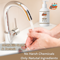 Person washing hands under a faucet using Gleamsure Sandalwood & Tulsi Handwash with label '99.9% Kills Germs & Bacteria – No Harsh Chemicals'.