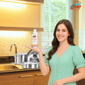 Woman holding plant-based dish wash in kitchen – sparkling clean utensils, eco-friendly and family-safe cleaning solution